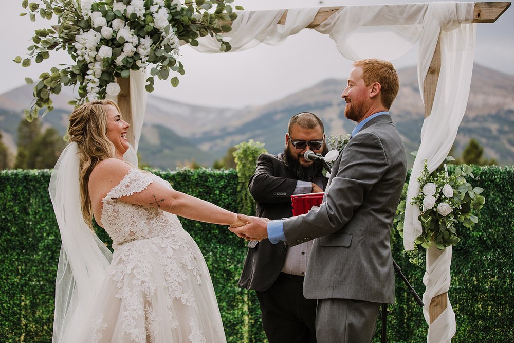 bride and groom reading handwritten personal vows, evening wedding at carter park, summer wedding in breckenridge colorado, park wedding venue in breckenridge colorado, summit county forest wedding