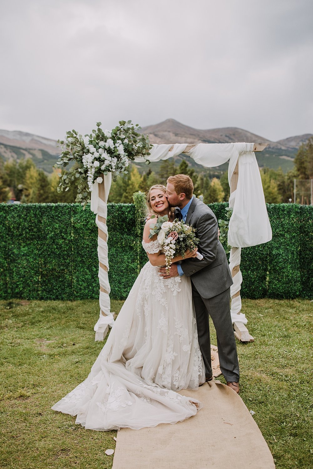 bride and groom standing in front of ceremony arch, wedding ceremony at carter park pavilion, vow ceremony in breckenridge colorado, reception space in breckenridge colorado