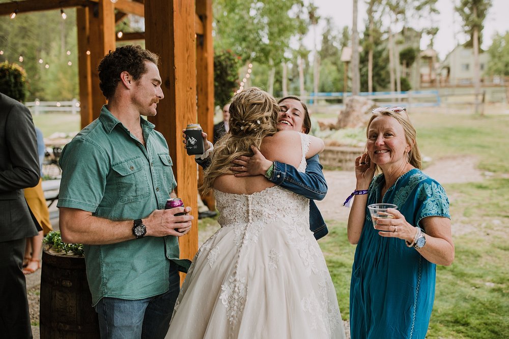 bride hugging wedding guests, wedding ceremony at carter park pavilion, vow ceremony in breckenridge colorado, reception space in breckenridge colorado