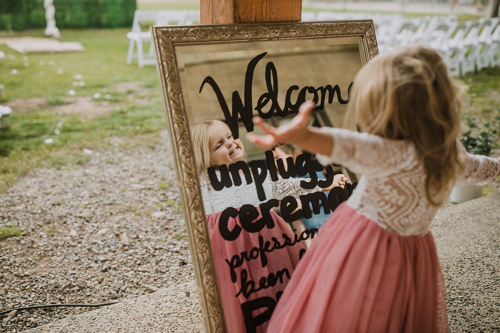 flower girl dancing in mirror, breckenridge colorado intimate wedding ceremony, carter park pavilion reception, summer wedding reception at carter park, breckenridge colorado wedding reception