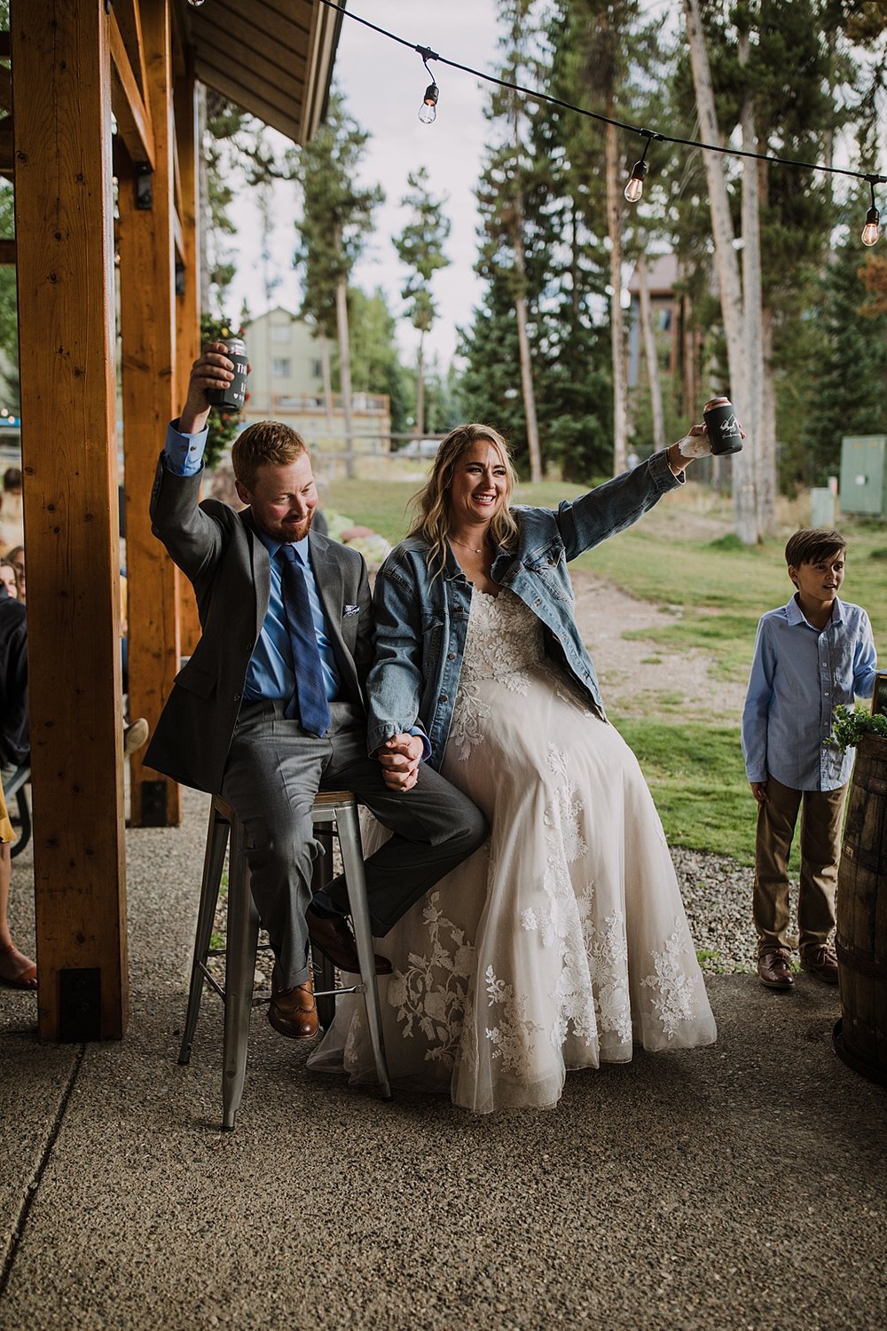 bride celebrating during speech, bridesmaid speech ideas, carter park outdoor reception, breckenridge colorado outdoor wedding, summer wedding on breckenridge mountain, summer mountain wedding