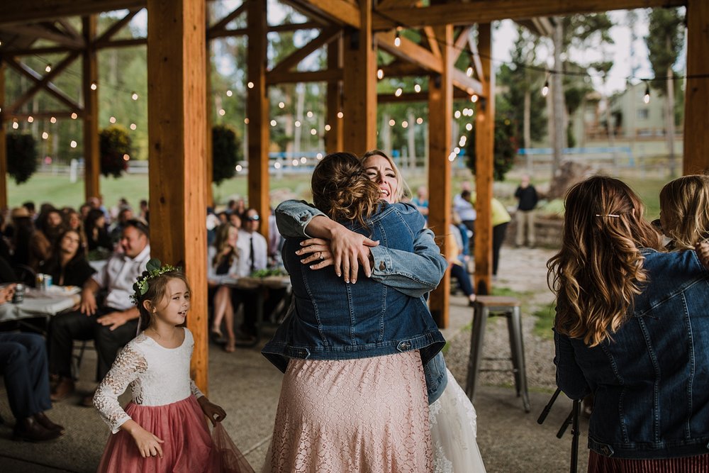 bride hugging bridesmaids, bridesmaid speech ideas, carter park outdoor reception, breckenridge colorado outdoor wedding, summer wedding on breckenridge mountain, summer mountain wedding