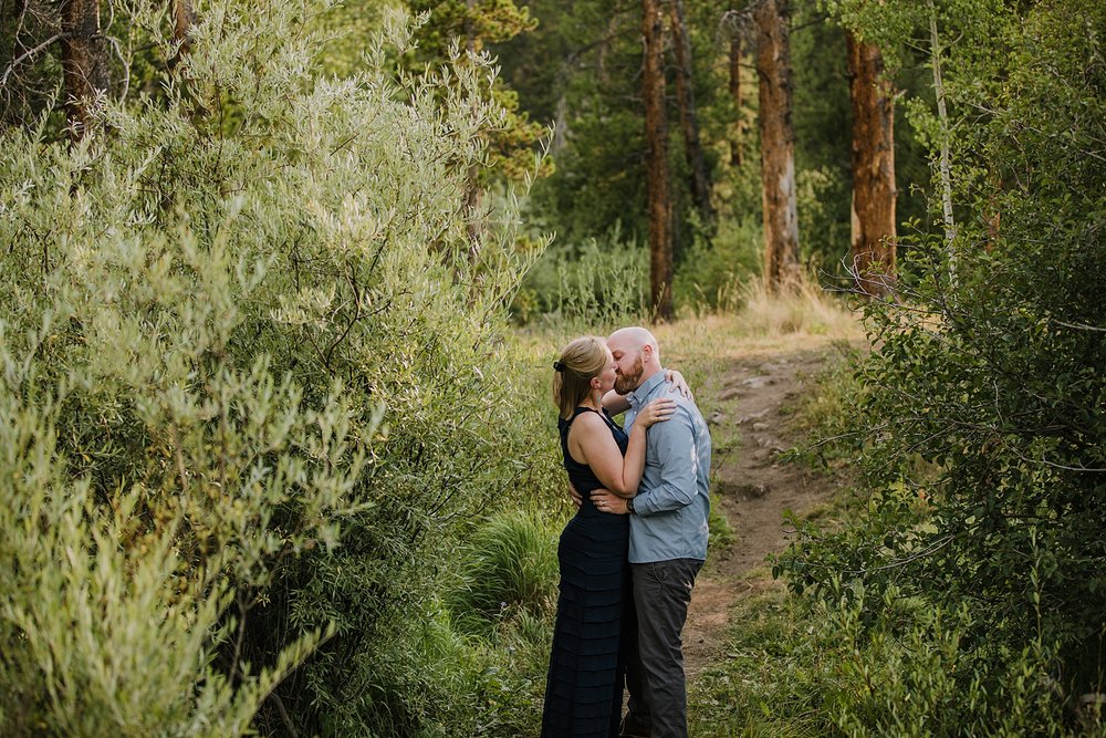 couple kissing in the woods, lily pad lake elopement, silverthorne pavilion wedding, mount buffalo elopement, summit county hiking elopement, summit county wedding