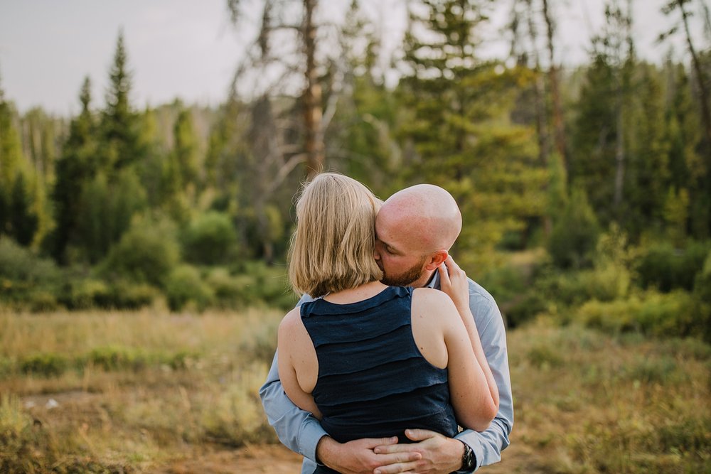 couple hugging on a hiking trail, wildernest colorado elopement, silverthorne pavilion wedding, gore range elopement, gore range hiking, eagles nest wilderness wedding