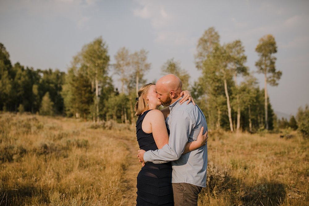 couple hugging, opal engagement ring, wildernest colorado elopement, silverthorne pavilion wedding, gore range elopement, gore range hiking, eagles nest wilderness wedding