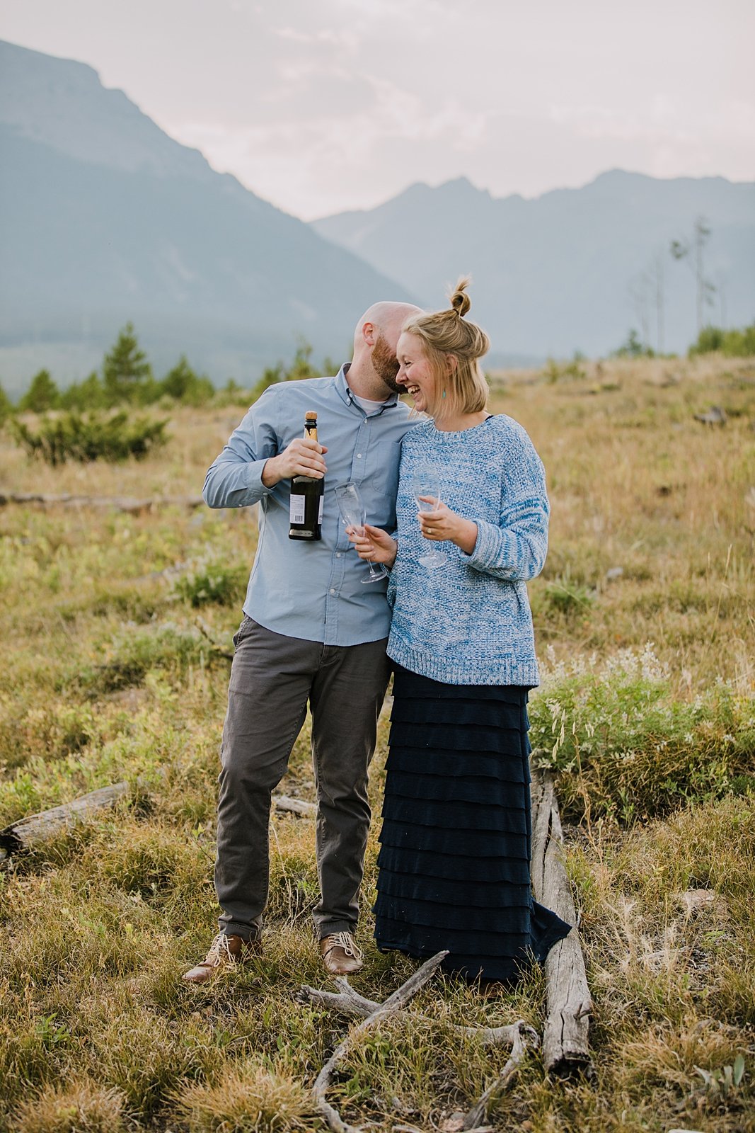 couple kissing, elopement champagne toast, silverthorne colorado wedding photographer, silverthorne pavilion wedding photographer, summit county wedding photographer, lily pad lake engagement