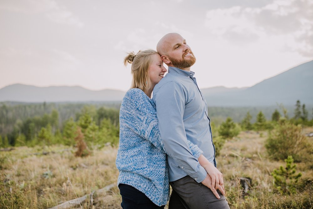 couple snuggling, continental divide elopement, colorado wildfire, summit county elopement photographer, silverthorne colorado elopement photographer, frisco colorado elopement photographer 