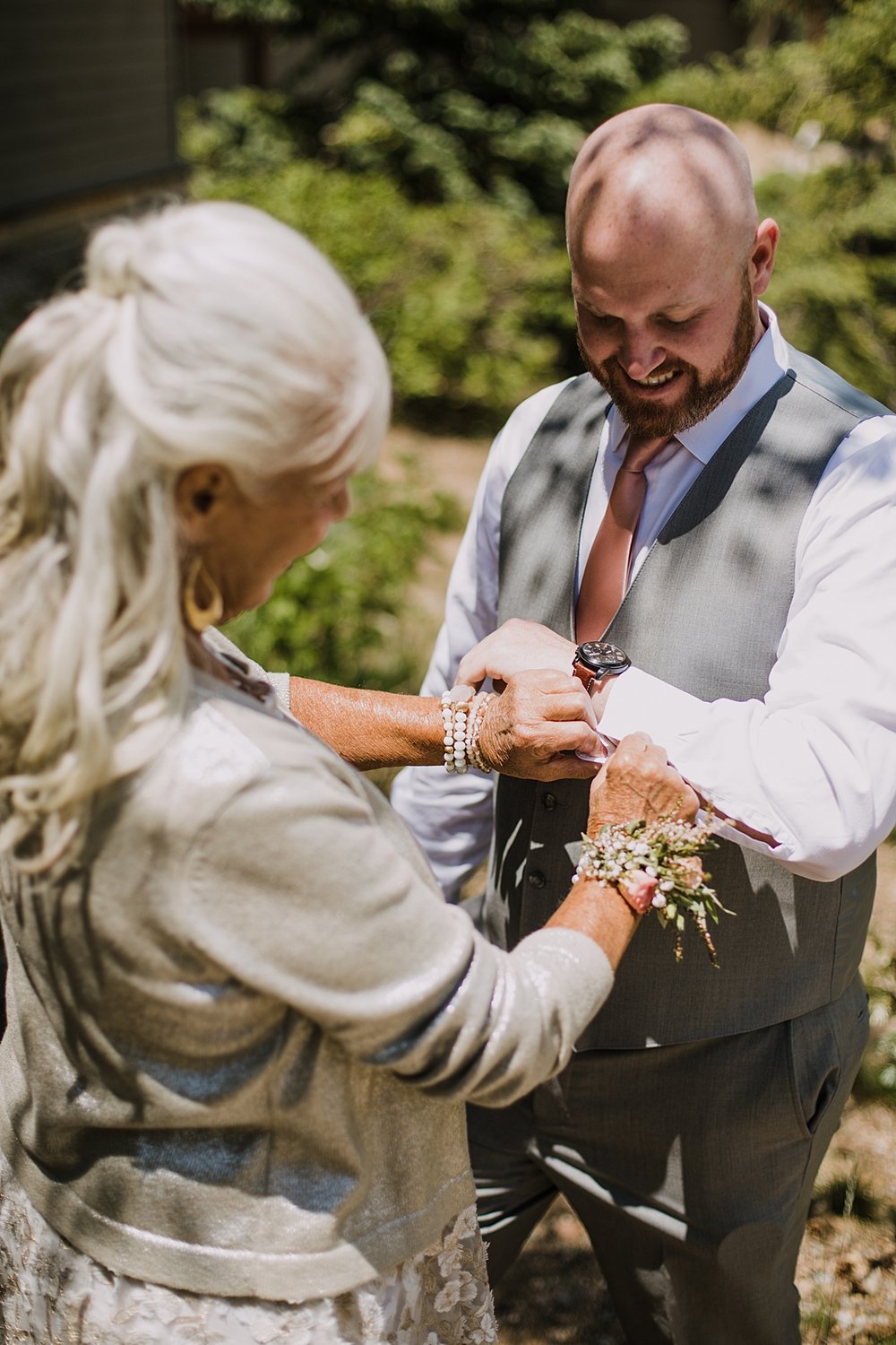 groom putting on cufflinks, groom getting ready, groom details, mountain groom, grooms attire, silverthorne colorado wedding, silverthorne colorado wedding photographer