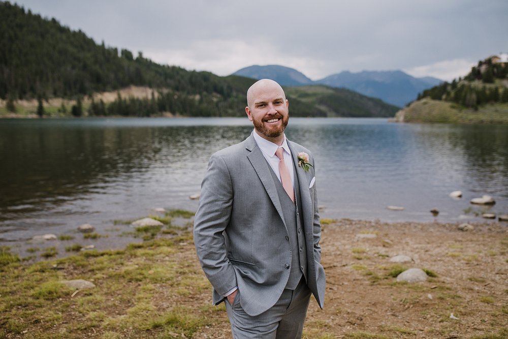 groom with pink tie and boutonniere, mountain florals, pink and sage wedding flowers, colorado mountain wedding, colorado mountain wedding photographer, frisco wedding florist, mountain roots florals