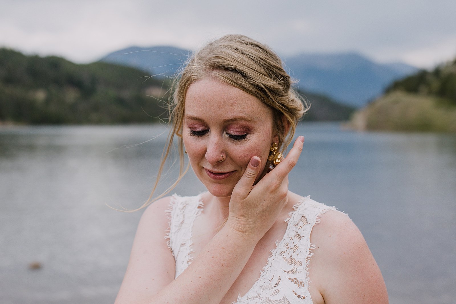 bride fixing hair, bride getting ready in the mountains, colorado mountain wedding, colorado mountain wedding photographer, rocky mountain wedding photographer, rocky mountain wedding