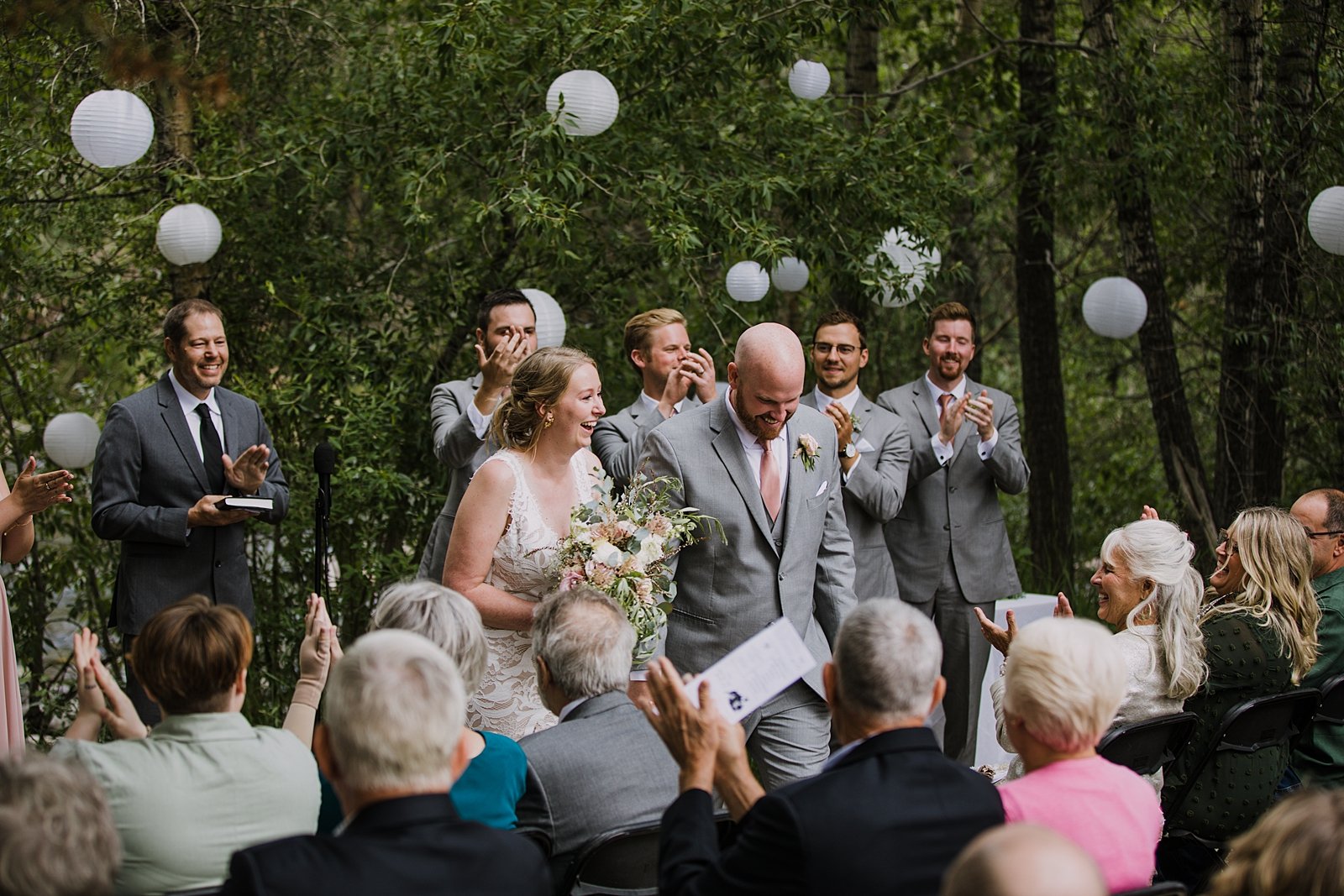 bride and groom walking the aisle together, walking the aisle as husband and wife, silverthorne pavilion wedding ceremony, silverthorne colorado bride, mountain couple, mountain bride, mountain groom