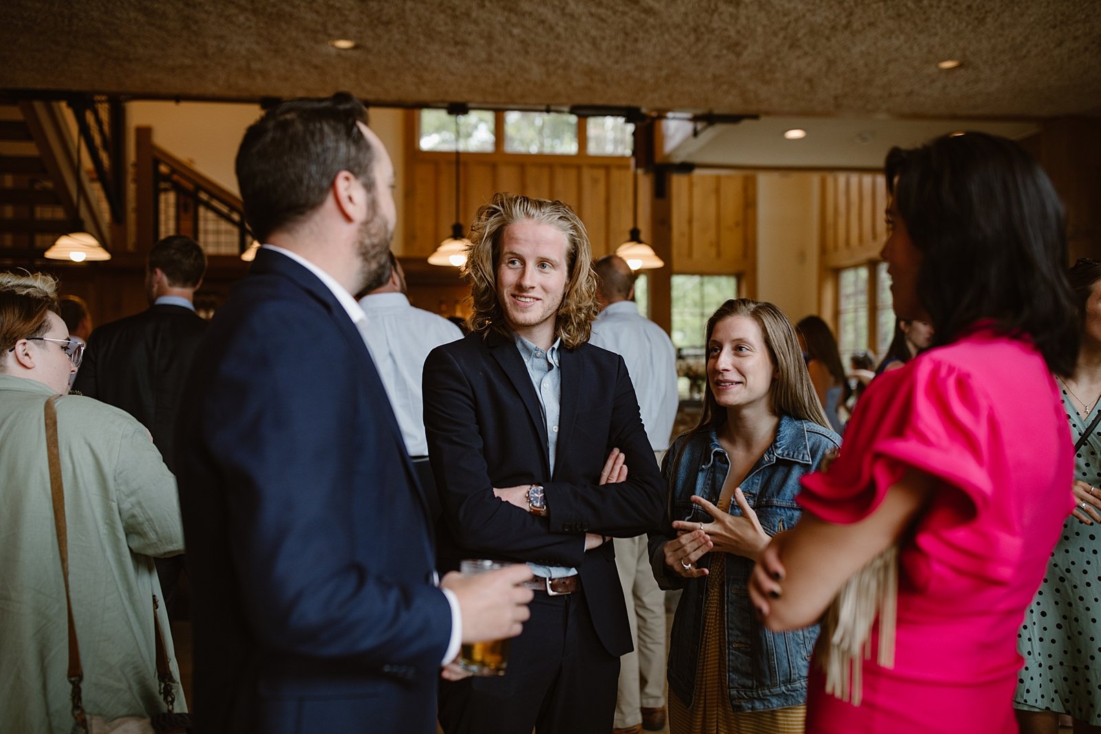 guests mingling at cocktail hour, silverthorne pavilion bar, silverthorne pavilion wedding reception, summit county wedding patio, silverthorne pavilion cocktail hour, silverthorne colorado wedding