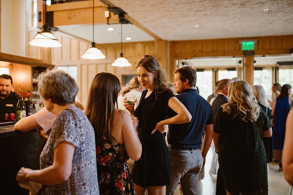 wedding guests ordering drinks from bar, summit county wedding bar, silverthorne pavilion wedding bar, silverthorne colorado cocktail bar, wedding cocktails, mountain wedding bar