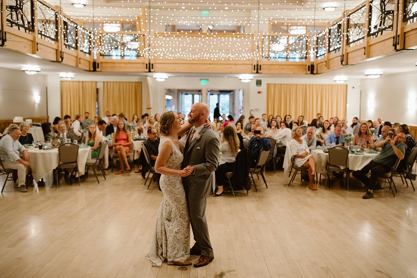 bride and groom's first dance, dancing as husband and wife, silverthorne pavilion dance floor, silverthorne colorado event space, summit county colorado event space, colorado mountain wedding venue