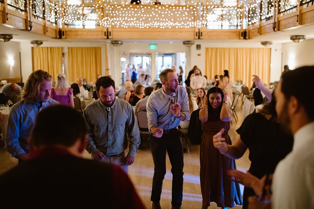 wedding guests dancing, wedding dancing under string lights, silverthorne pavilion dance floor, summit county wedding dance floor, silverthorne colorado wedding photographer, silverthorne wedding DJ