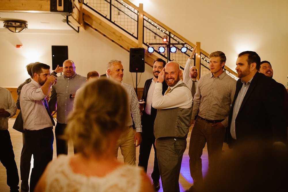 wedding guests dancing, wedding dancing under string lights, silverthorne pavilion dance floor, summit county wedding dance floor, silverthorne colorado wedding photographer, silverthorne wedding DJ