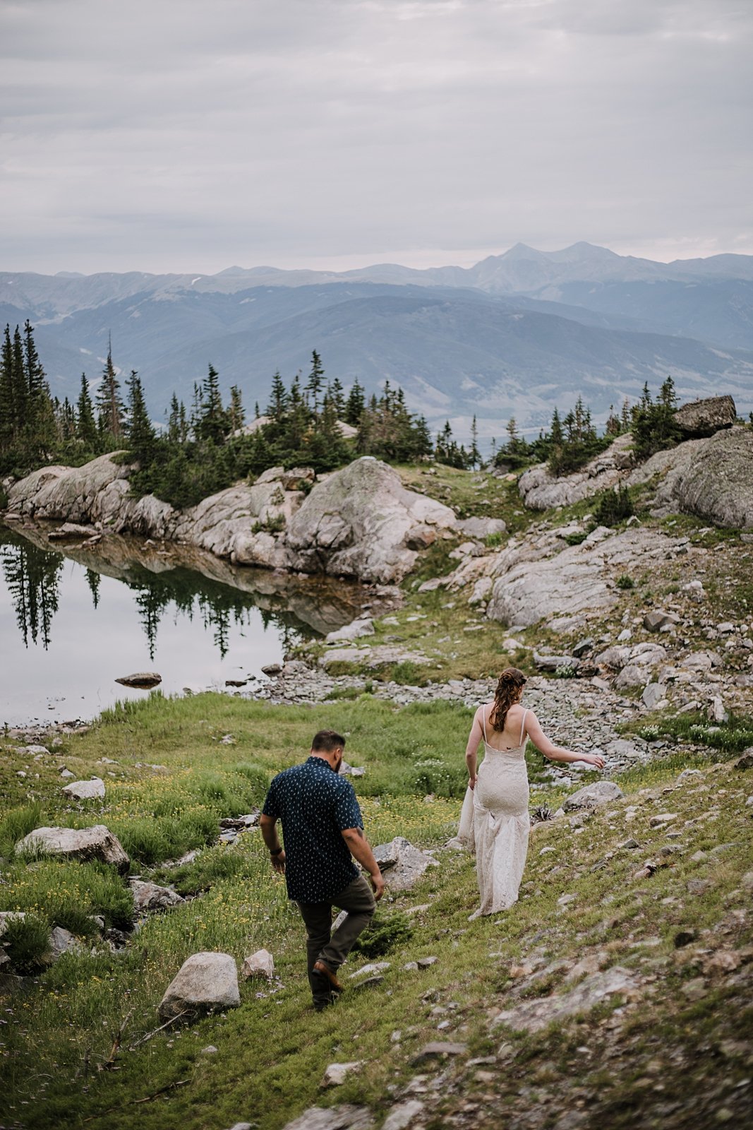 bride and groom hiking together, mohawk lakes elopement, crystal lakes elopement, summer mountain elopement, breckenridge wildflower elopement, colorado trail elopement, bride and groom hiking attire