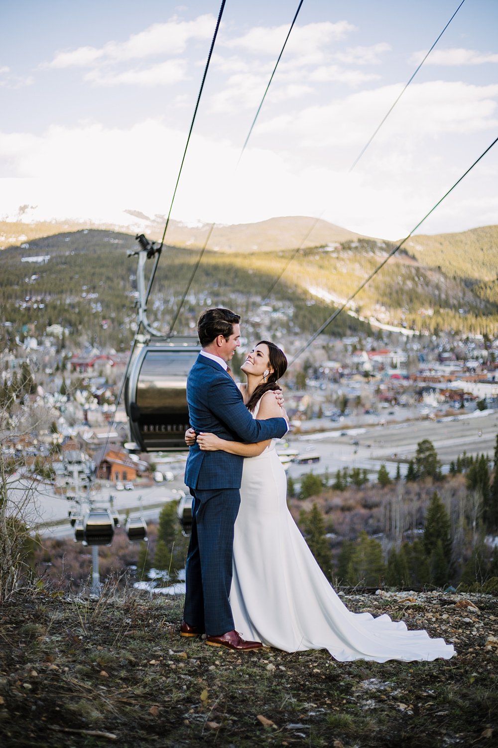 bride and groom under the breckenridge gondola, view of downtown breckenridge, breckenridge elopement, breckenridge wedding, breckenridge nordic center wedding, breckenridge sevens wedding