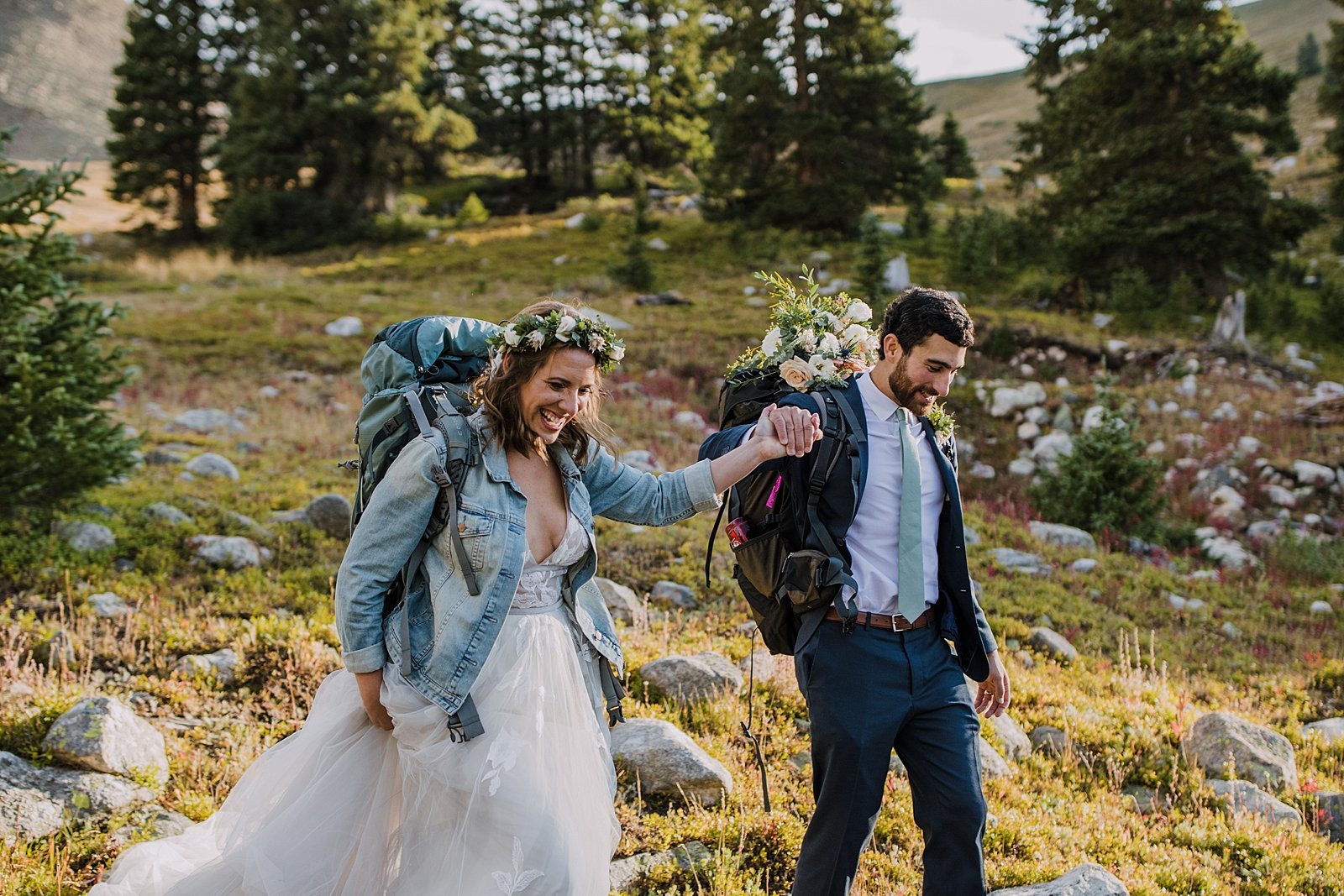 couple hiking in wedding attire, breckenridge hiking elopement, mt quandary elopement, blue lakes waterfall elopement, backpacking elopement, bhldn wedding dress, bridal flower crown
