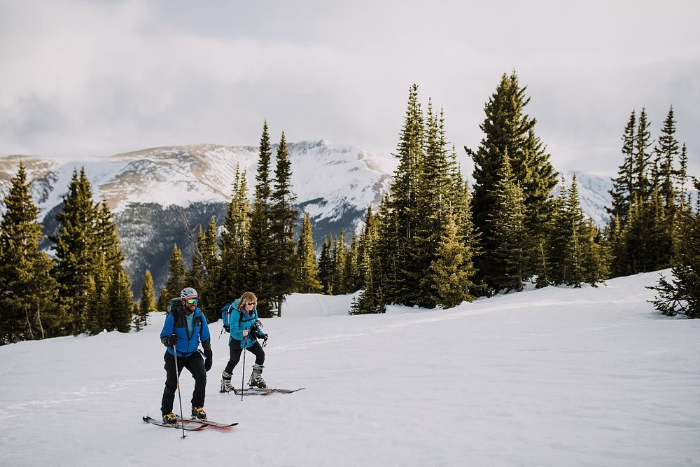 couple skinning together, at ski elopement, backcountry ski elopement, ski elopement, breckenridge ski elopement, winter ski resort wedding, winter adventure elopement, bald mountain ski elopement