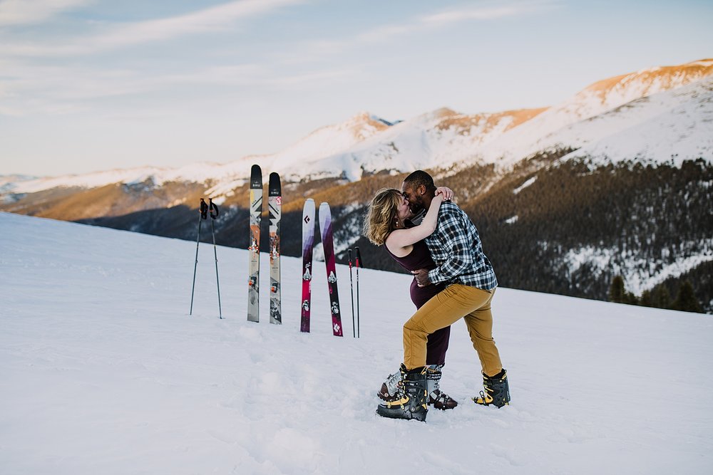 groom dipping bride, breckenridge backcountry ski elopement, colorado ski elopement, breckenridge ski resort wedding, bride and groom skiing together, bald mountain ski elopement, plaid grooms shirt