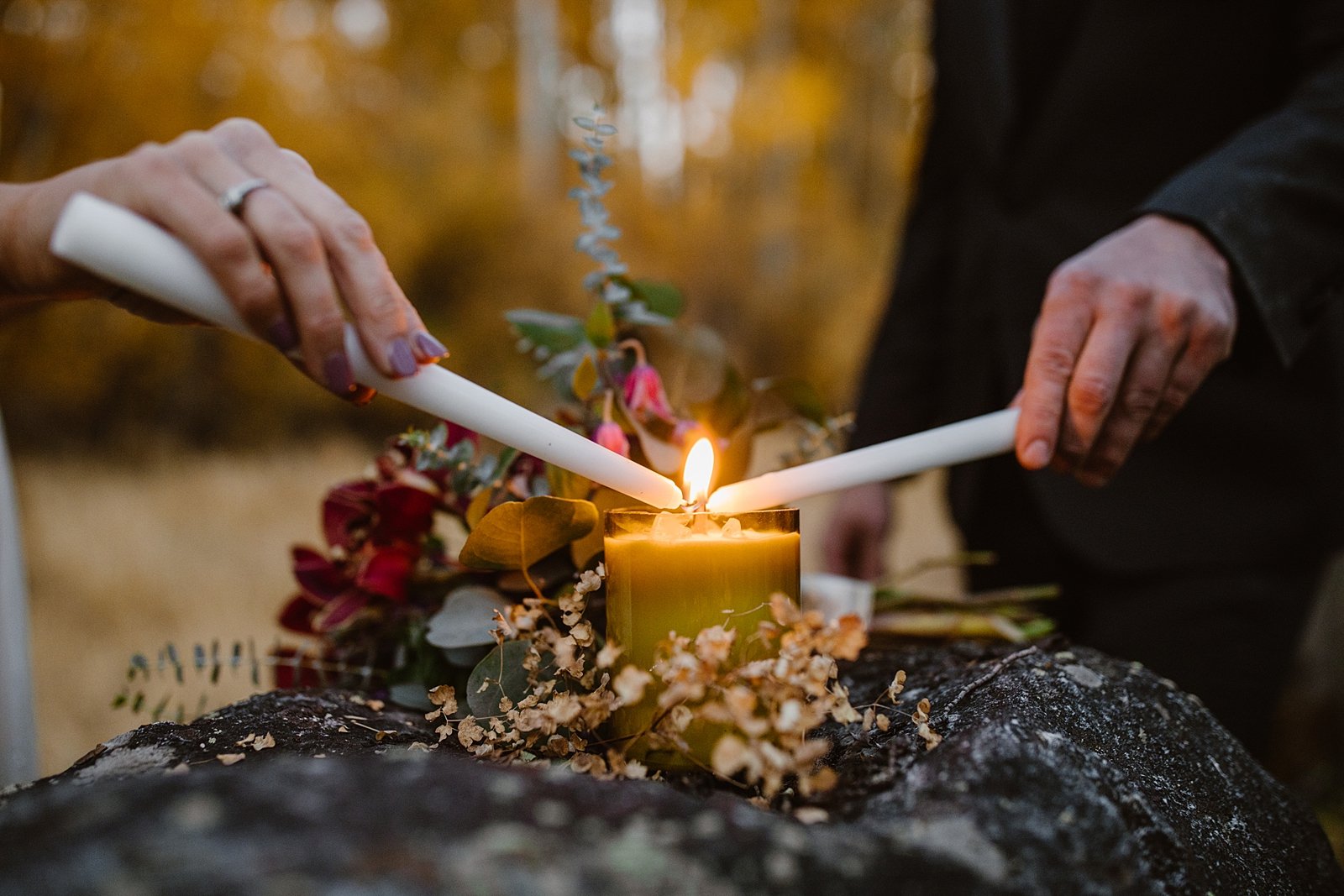 couple lighting unity candle, elopement unity candle, unique elopement ceremony, bridal nails, fall breckenridge elopement, aspen leaf elopement, dark colors elopement, breckenridge october elopement 