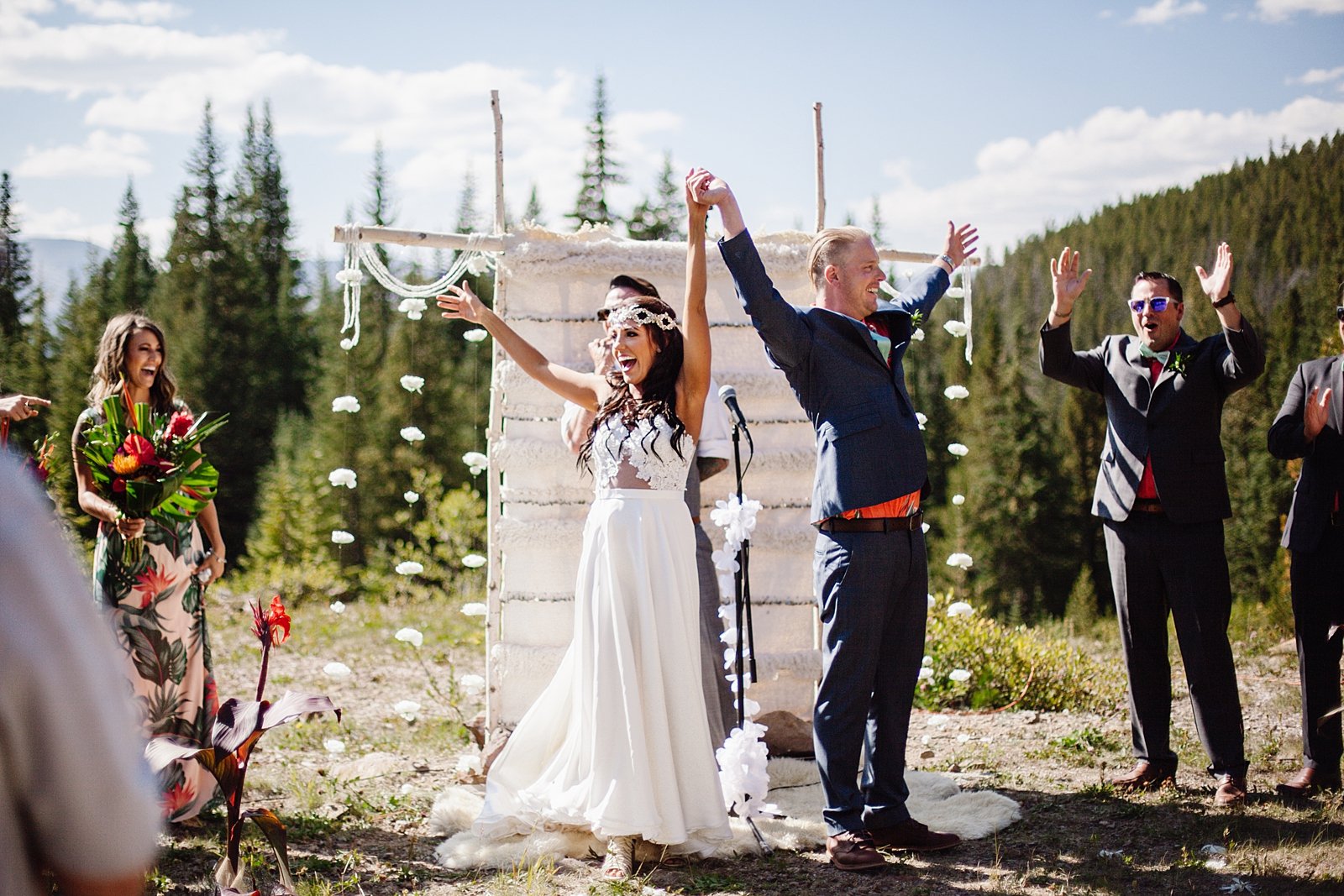 bride and groom celebrating after being pronounced husband and wife, desiree hartsock wedding dress, bridal headband, tropical bridesmaid dress, tropical wedding flowers, baldy road elopement