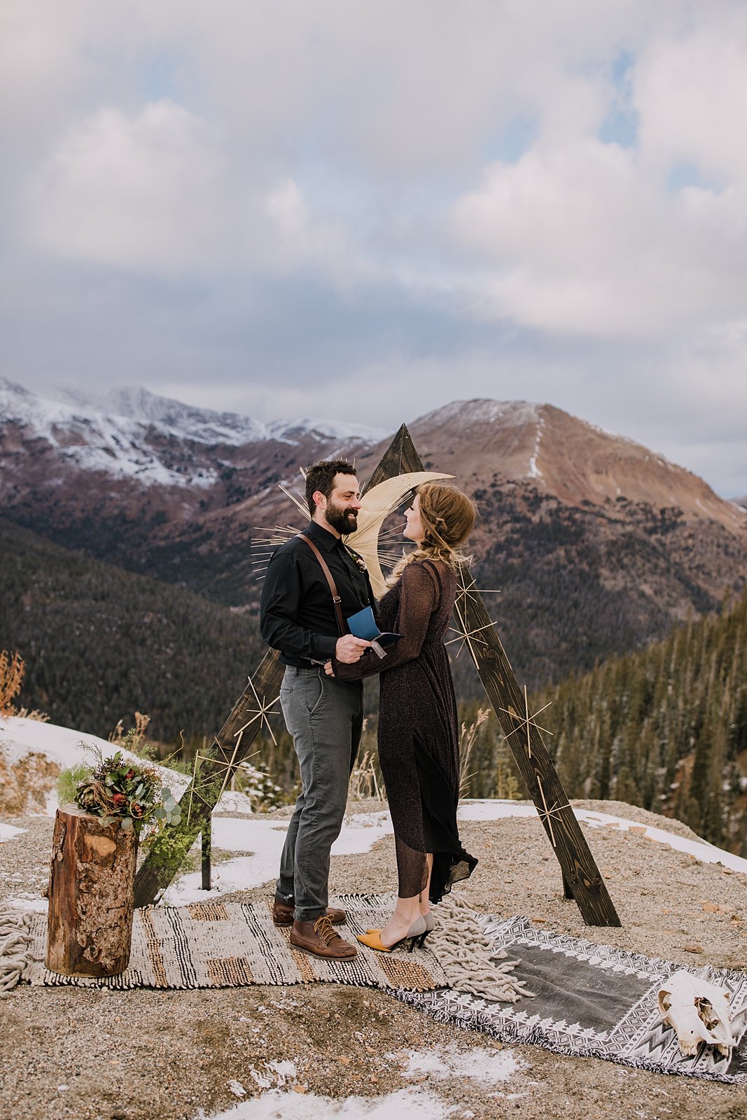couple reading handwritten vows to one another, summit county elopement, summit county wedding, arapaho basin elopement, arapaho basin wedding, loveland pass elopement, loveland pass ceremony site