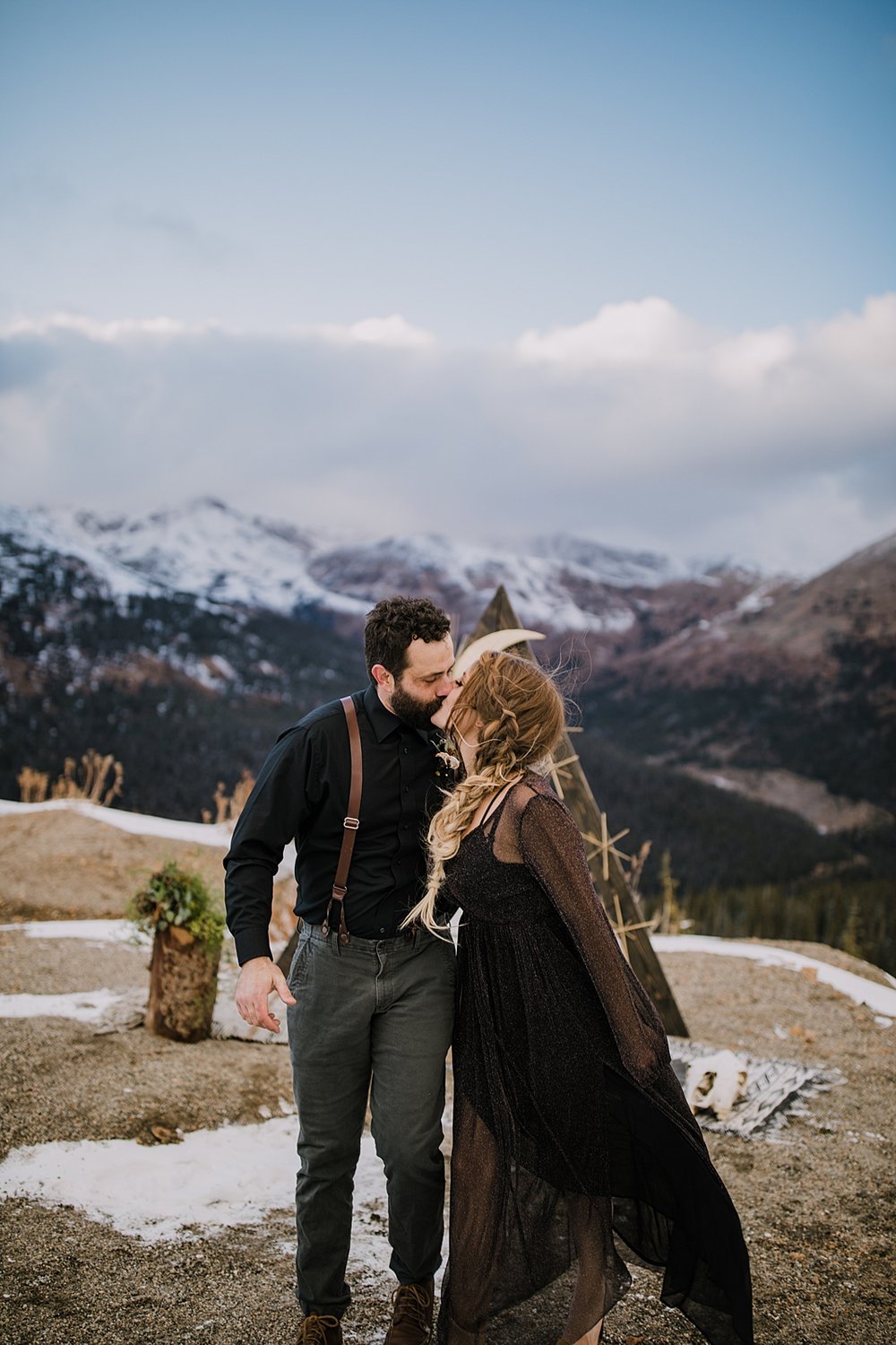 bride and groom kissing at the end of ceremony, terrestrial wedding, terrestrial elopement, groom wearing suspenders, galactic elopement, galactic wedding, interstellar elopement, interstellar wedding