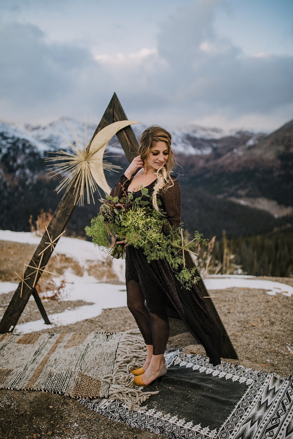  bride holding fall themed bridal bouquet, florals with artichokes, autumn wedding florals, moody fall floral, unique wedding bouquet, fall bridal bouquet, witchy bridal bouquet, dark wedding dress