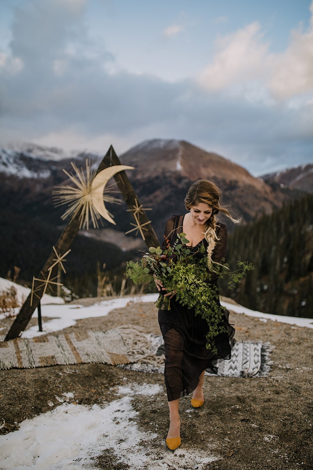  bride walking with bridal bouquet, artichoke in a bridal bouquet, cool autumn florals, spooky fall bridal bouquet, october wedding bouquet, witchy bridal bouquet, dark wedding dress, whispy bouquet