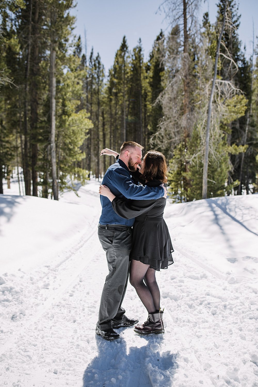 couple walking in the snow, snowy engagement, engagements in the woods, proposal in the woods, swan river valley engagement, swan river valley winter activities, breckenridge winter activities