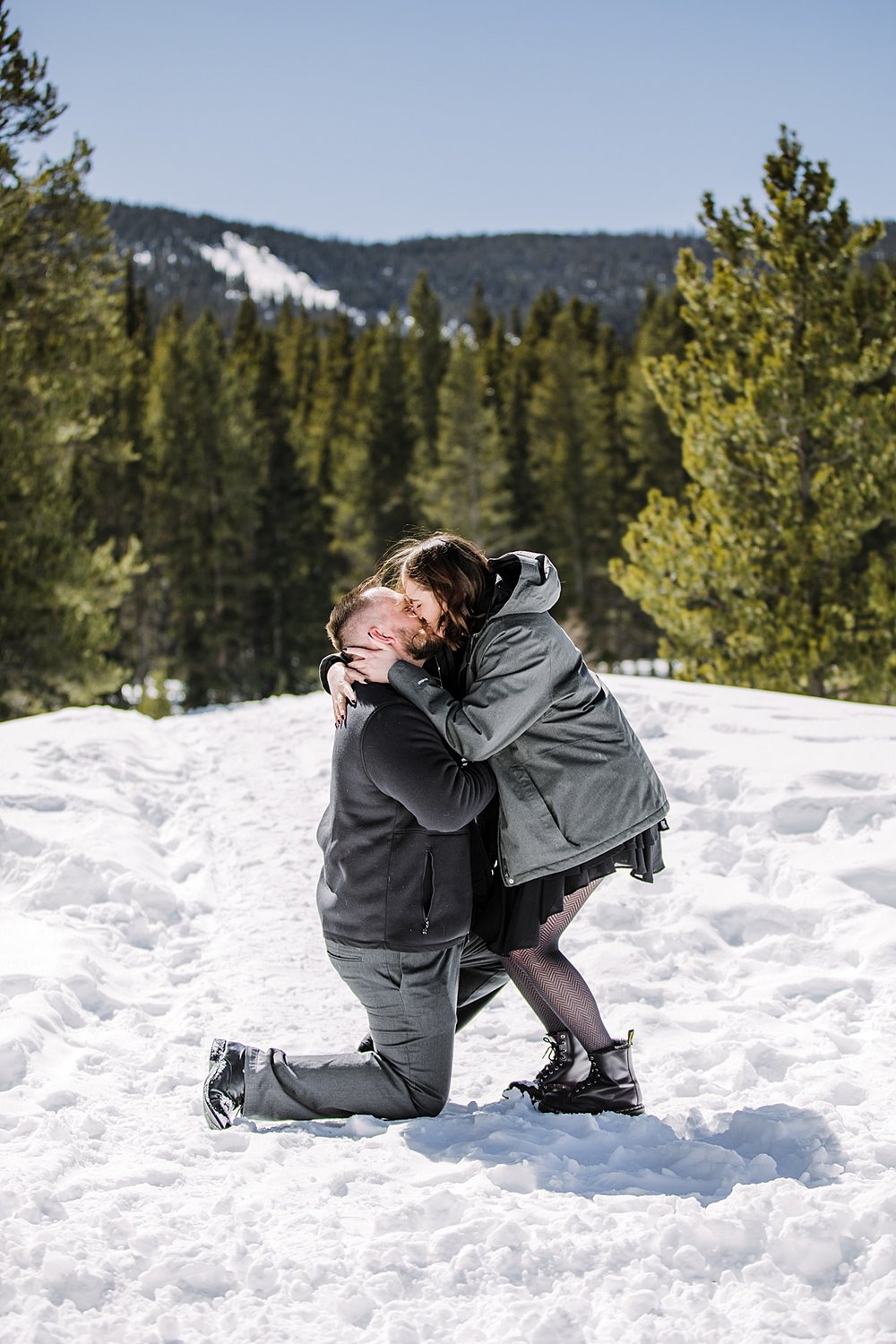couple kissing in the snow, proposal in the woods, breckenridge mountain proposal, breckenridge engagement proposal, golden horseshoe proposal, horse sleigh ride proposal, colorado winter activities