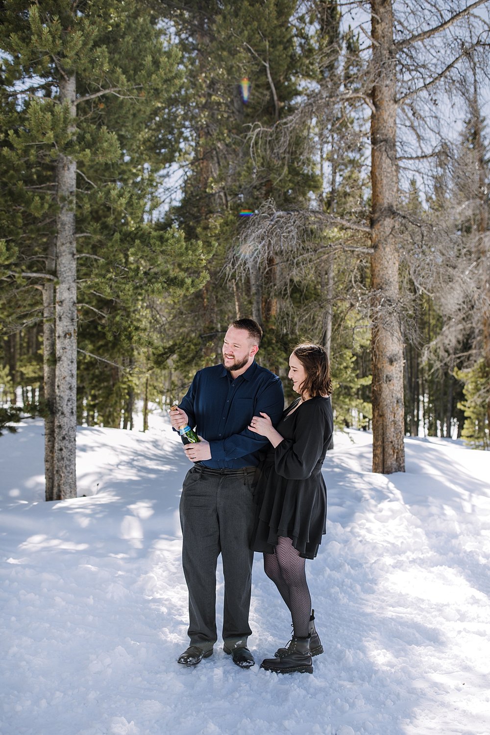 couple popping champagne, popping champagne in the woods, post proposal champagne pop, popping champagne in the mountains, proposal champagne pop, champagne pop in the national forest