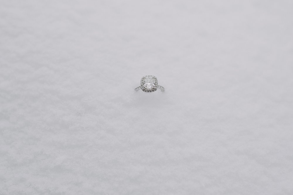 engagement ring sitting in the white fluffy snow, summit county engagement ring, breckenridge engagement ring, mountain engagement ring, snow surrounding engagement ring, engagements in the snow
