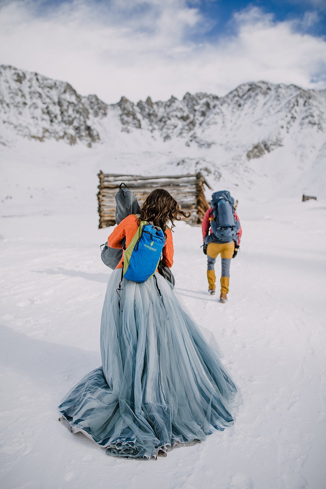 bride and groom hiking in the snow, mayflower gulch winter elopement, mayflower gulch elopement, leadville colorado elopement, leadville colorado winter elopement, snowy mountain wedding