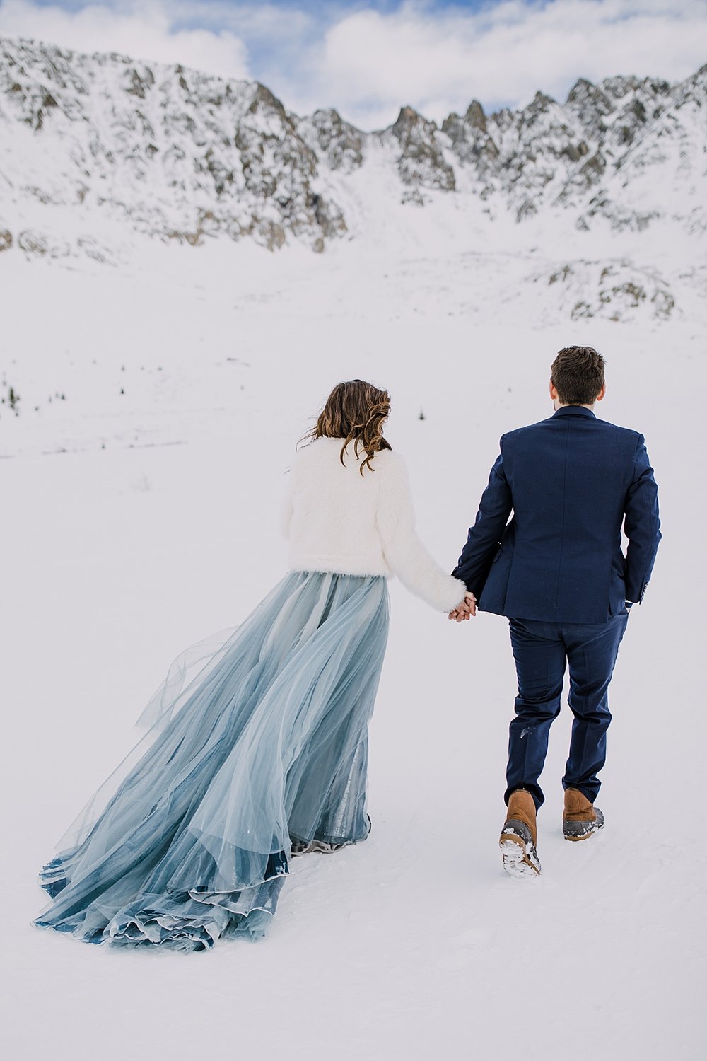 bride and groom walking hand in hand, custom wedding suit, fletcher mountain elopement, quandary mountain elopement, leadville elopement, breckenridge elopement