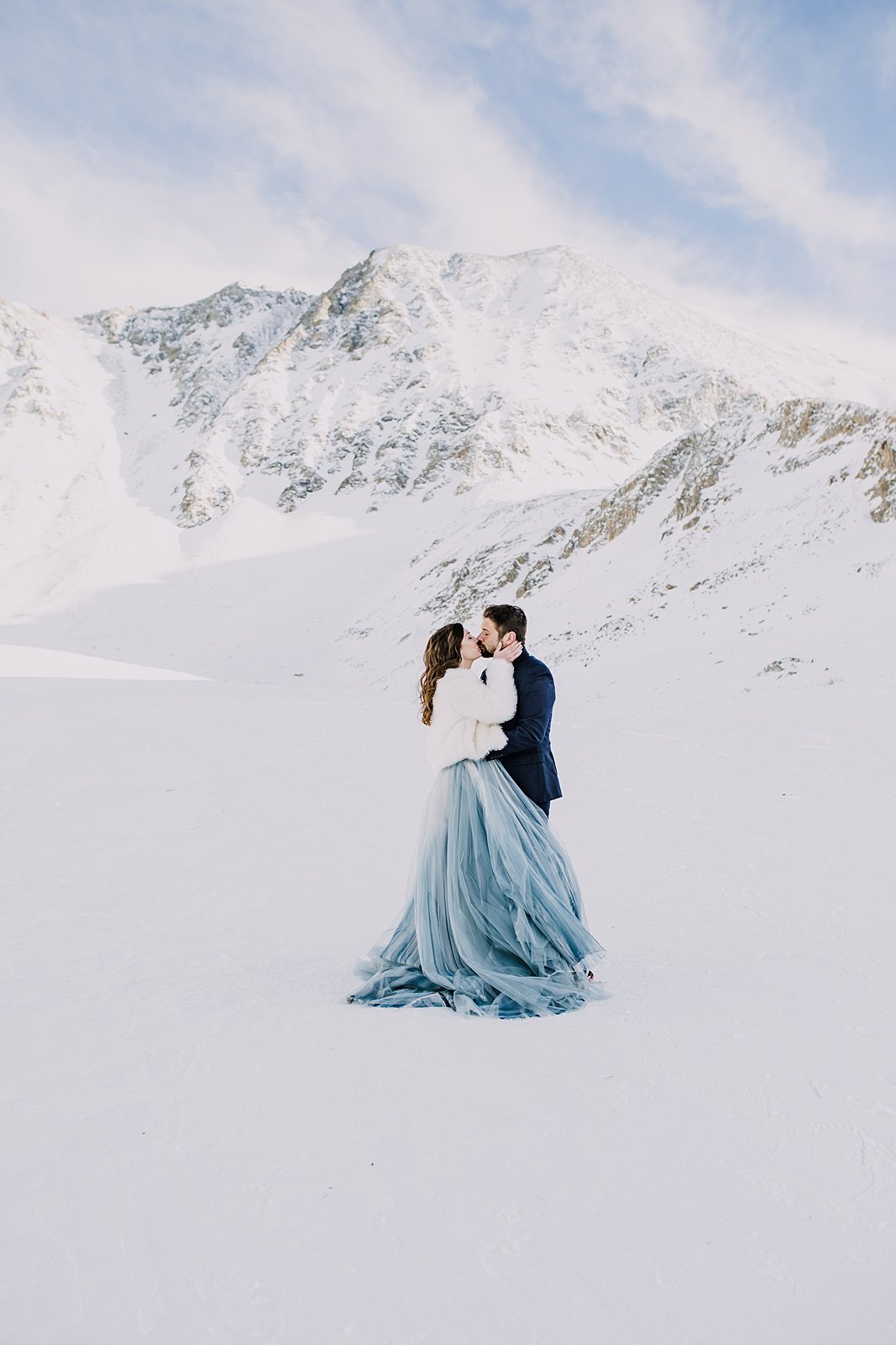 bride and groom kissing in the snow, couple kiss in mountain valley, quandary mountain elopement, colorado snowy elopement, mountain valley elopement, mountain gulch elopement