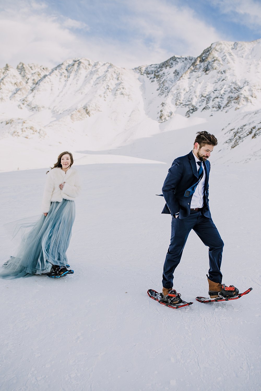 Bride and groom snowshoeing in mountain valley, snowshoeing in mayflower gulch, snowshoeing quandary peak, snowshoe to mountain cabin, yukon charlies mens snowshoes