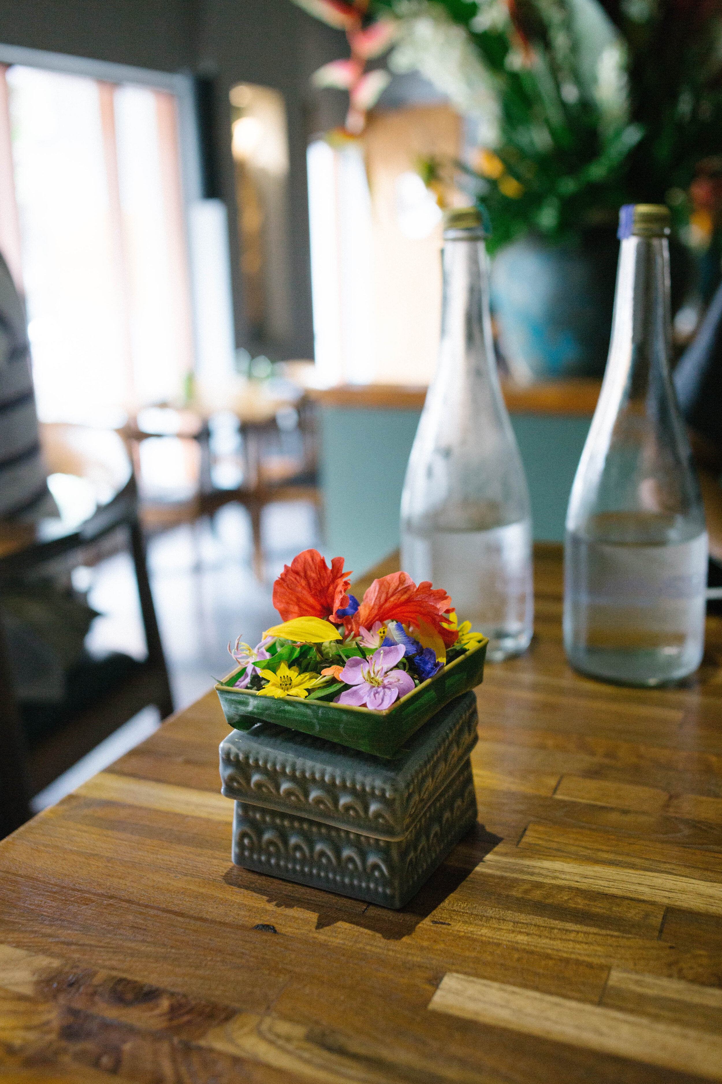  Edible flowers sprayed with hibiscus vinegar and topped with salt 