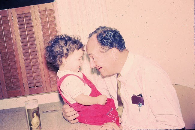 Benjamin Moss plays with his granddaughter, Shelah Moss, 1966.