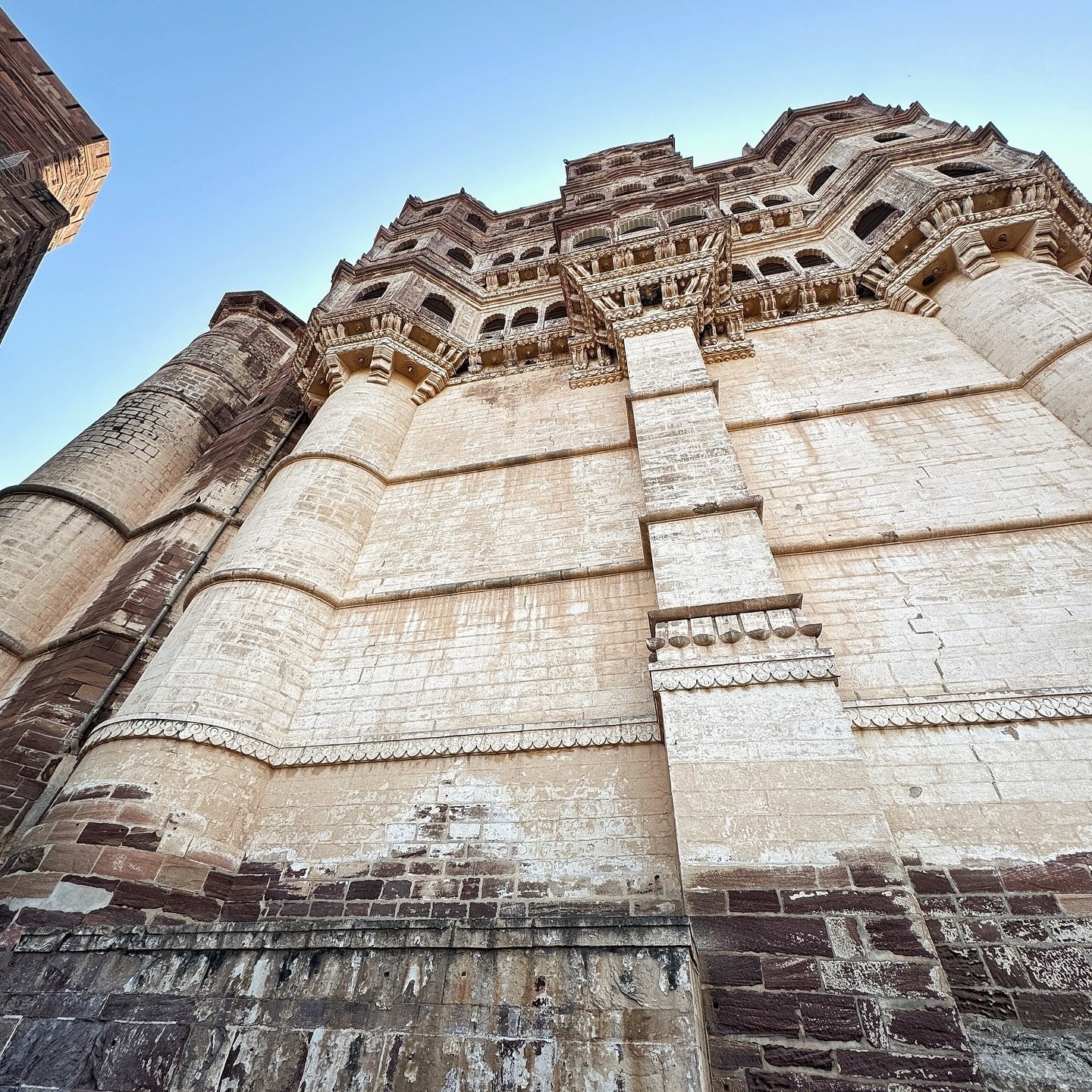 Mehrangarh fort is one of the most beautiful, massive and at the same time intricate architectural wonders of India. 

It is an historic fort located in Jodhpur, Rajasthan. It stands on a hilltop, rising about 122 m above the surrounding plains and t