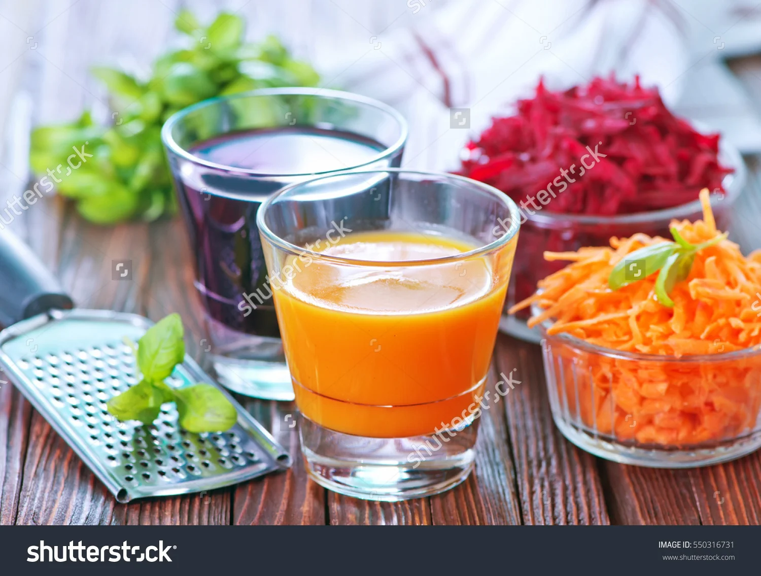 stock-photo-carrot-juice-and-beet-juice-in-the-glasses-550316731.jpg
