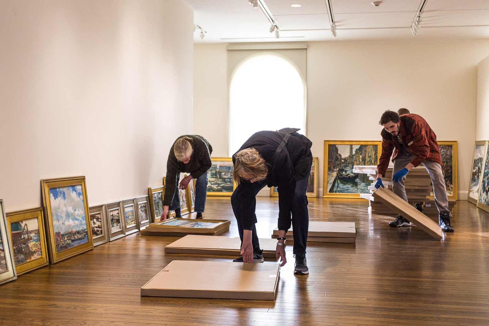 Martha Oaks (left) and Leon Doucette (right) help unpack "Cape Ann and Beyond" at the Cape Ann Museum. And a very special thanks (as always) to local painter and friend Marilyn Swift (center) for her unending support.