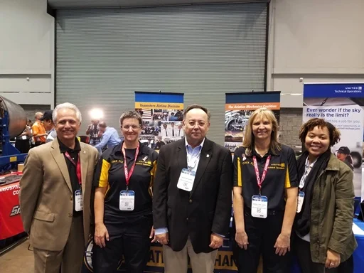 (L to R) International Representative Paul Alves, USMC Veteran and Avionics Technician Joanne Mulherin (SFO-31 years) , Division Director David Bourne, Dana Eads (DEN MX Supervisor and Team Coach) and Deputy Division Director Allynn Allen at the MRO Competition.