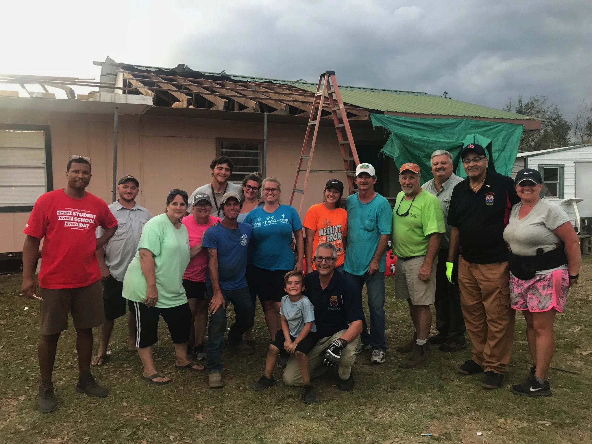 “Hotshot” is a term used to describe a short notice call for immediate assistance. This photo is right after such a delivery. An IBT Local 991 Steward contacted the crew who was able to get an immediate delivery of supplies to a local church whose pastor was coordinating donations and distribution to many elderly people and those who had no access to transportation. IBT Disaster Coordinator and Local 769 Business Agent David Renshaw is in the foreground with Brother Roy Gillespie, IBT Disaster Relief Coordinator (Second on right)