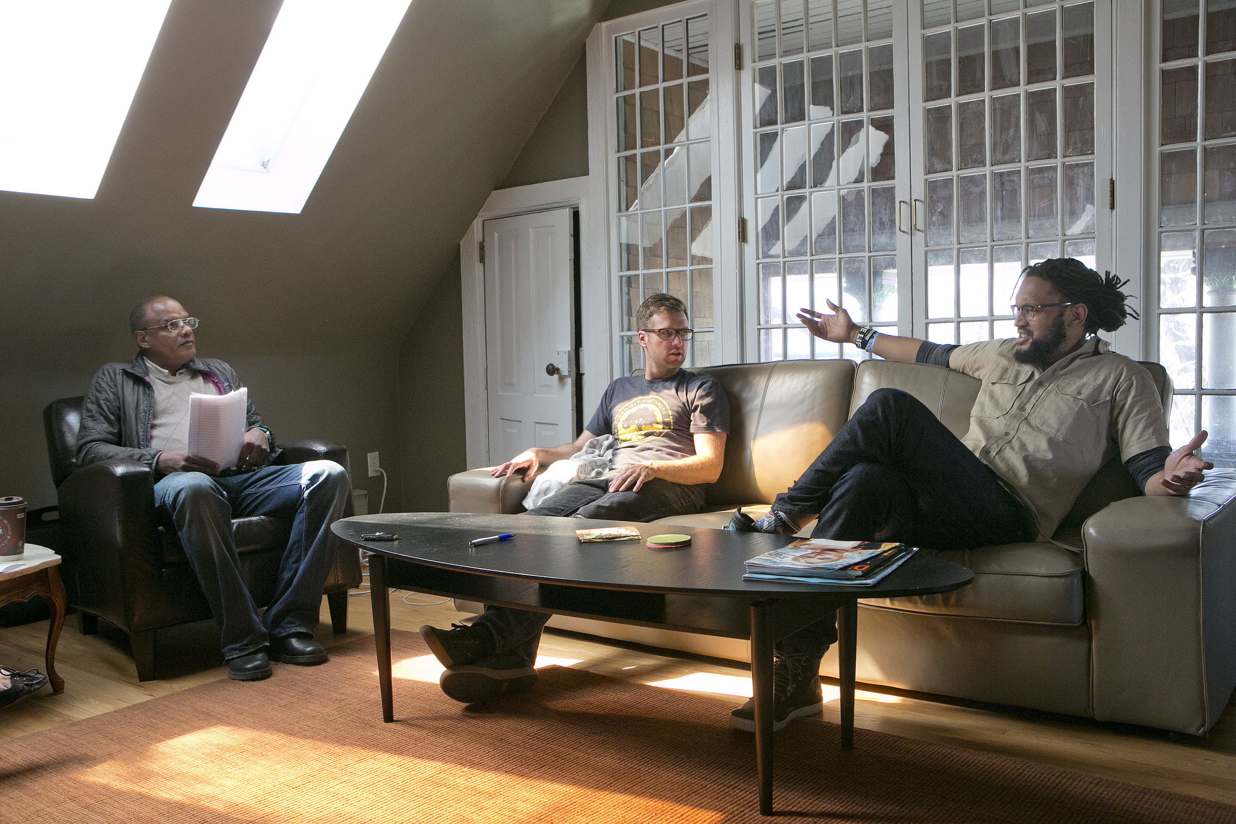 From left: Denver VOICE vendor Michael Burkley, Flobots Jamie Laurie and Stephen Brackett. Credit: Giles Clasen