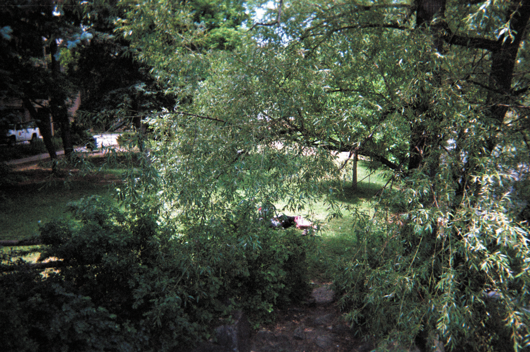 Person sleeping near the Boulder Library