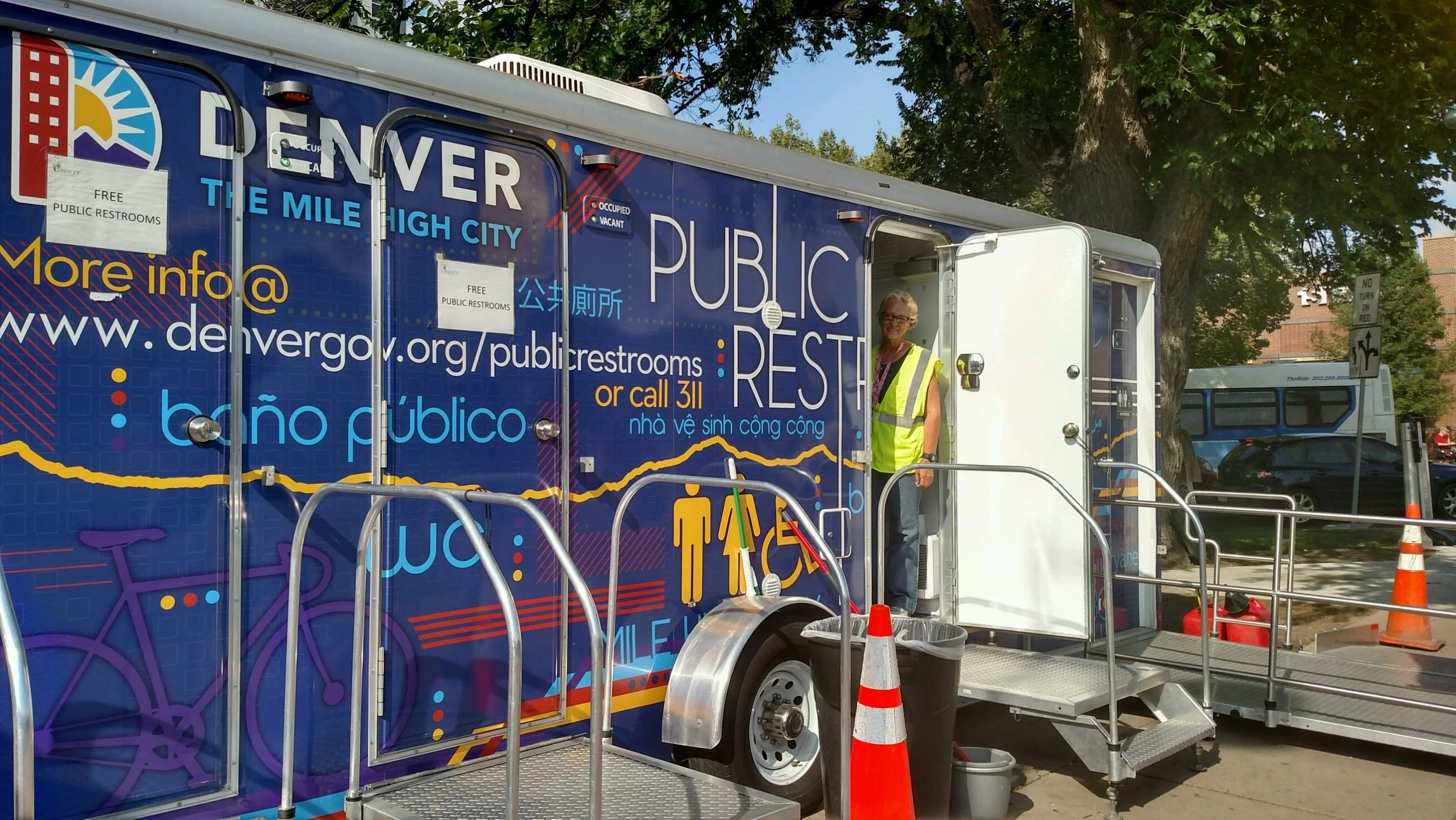 A mobile restroom at the intersection of Franklin and Colfax. Each restroom has three stalls and is maintained by an attendant. Credit: Sarah Ford