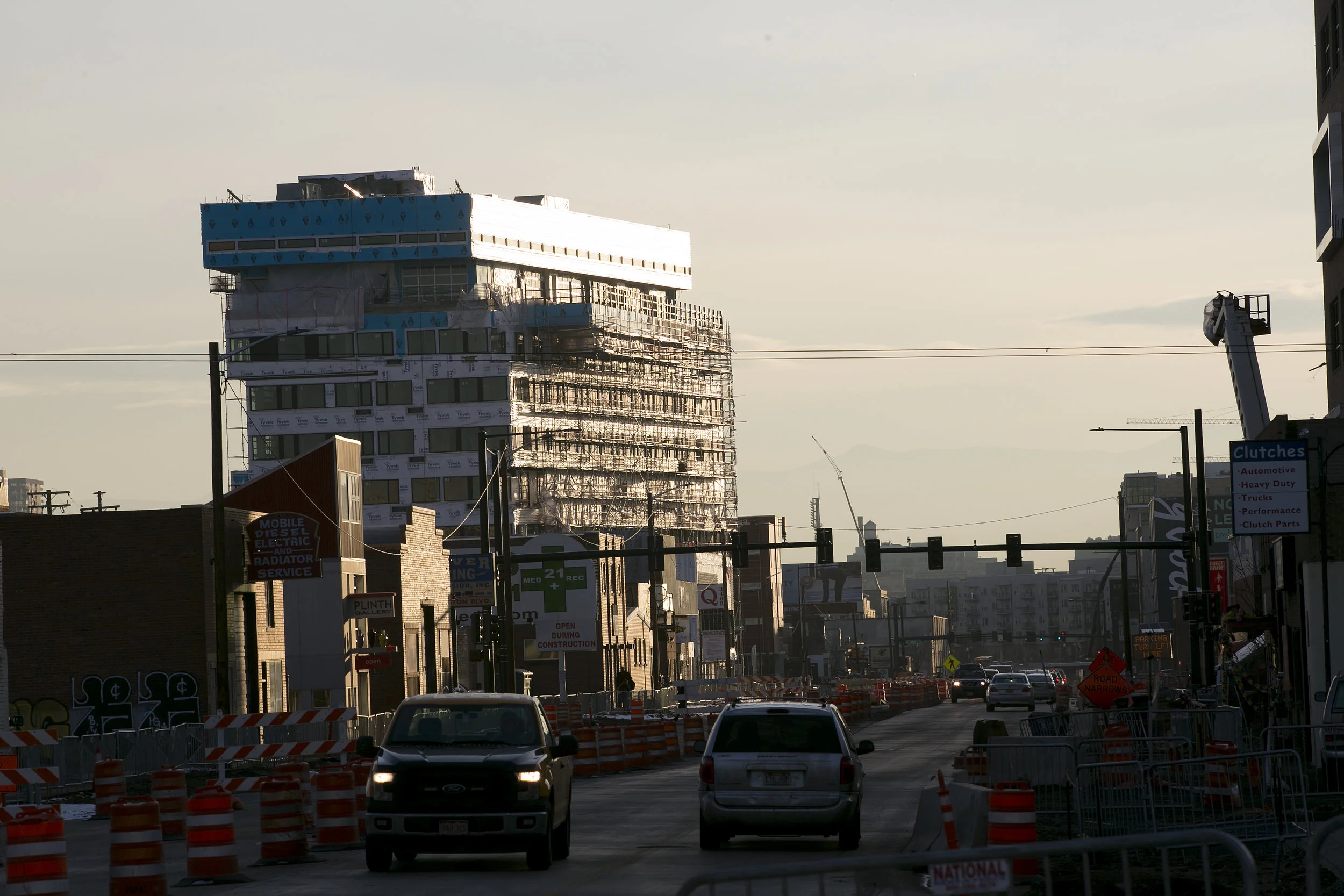 Ongoing construction on Brighton Blvd. in River North, one of the most rapidly developing neighborhoods in Denver. Jordan Artach moved out of a nearby apartment after rent rose $500 in a single month. (Credit: Giles Clasen)